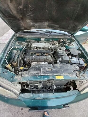 Kia  1999, 400,000 km - 1.8 l - Bakı
