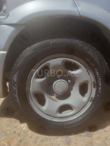 Suzuki Grand Vitara 1999, 226,531 km - 2.5 l - Quba