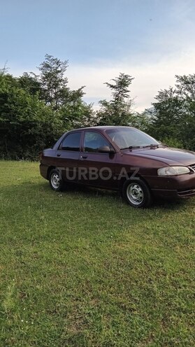 Kia  1999, 266,415 km - 1.5 л - Quba