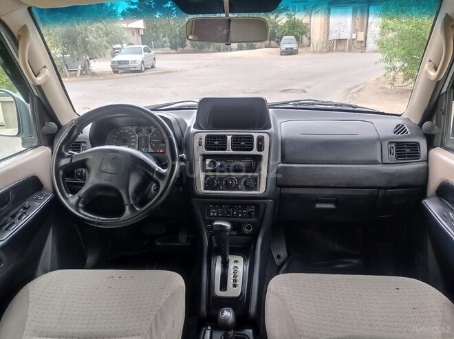 Mitsubishi Pajero io 2002, 303,000 km - 2.0 л - Xırdalan