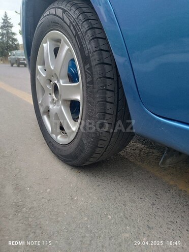 Kia Rio 2009, 242,944 km - 1.4 l - Quba