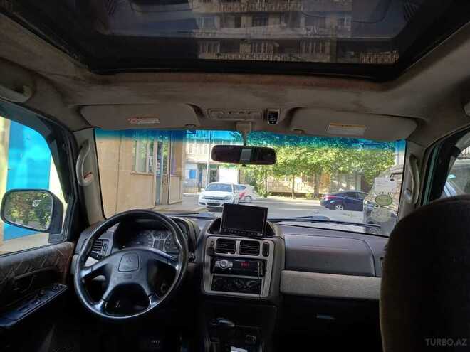 Mitsubishi Pajero io 1999, 285,000 km - 1.8 l - Bakı