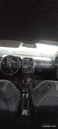 Opel Astra 1999, 128,000 km - 1.4 l - Qax