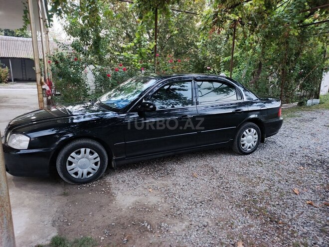 Kia Optima 2005, 489,360 km - 2.4 l - Ucar