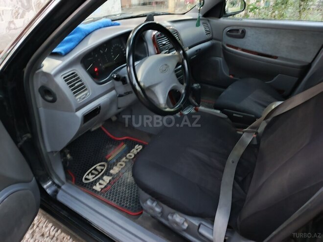 Kia Optima 2005, 489,360 km - 2.4 l - Ucar