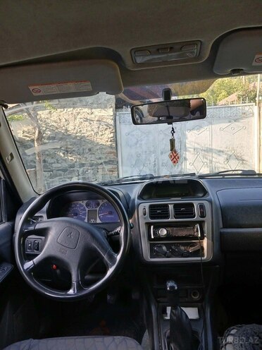Mitsubishi Pajero io 2003, 204,480 km - 2.0 л - Qax
