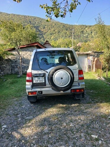 Mitsubishi Pajero io 2003, 204,480 km - 2.0 л - Qax