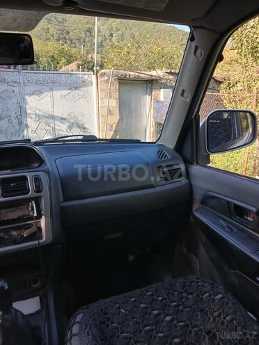 Mitsubishi Pajero io 2003, 204,480 km - 2.0 л - Qax