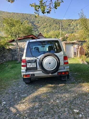 Mitsubishi Pajero io 2003, 204,480 km - 2.0 л - Qax