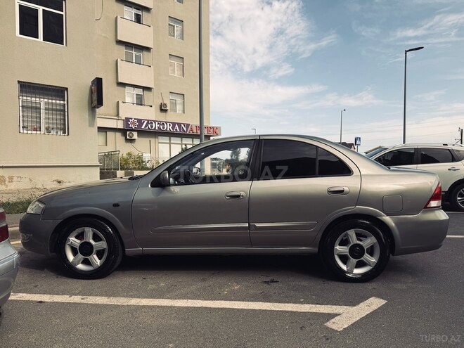 Nissan Sunny 2009, 296,000 km - 1.6 l - Bakı